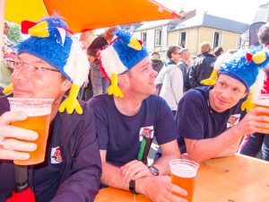 People wearing hats and drinking beer